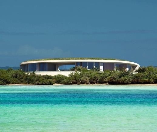 AMIHAN hospitality building beside turquoise water